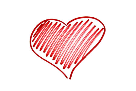 A heart with an arrow is drawn with a red marker on a white isolated background.の写真素材