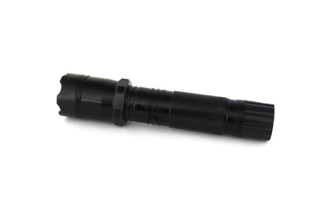 On a white background lies a shocker and a flashlight in one device.の写真素材