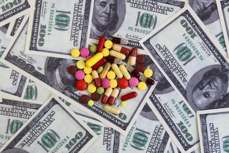 Capsule pills lie on the dollar money.の写真素材