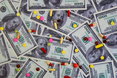 Capsule pills lie on the dollar money.の写真素材