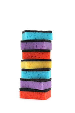 A stack of multi-colored sponges is on a white isolated background.