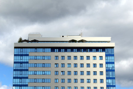 High-rise house sleep against blue sky background with clouds.の写真素材