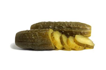 Salted tasty cucumbers lie on a white isolated background.の写真素材