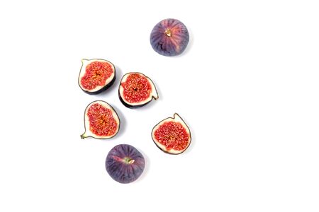Halves of ripe fruit on a white background.の写真素材