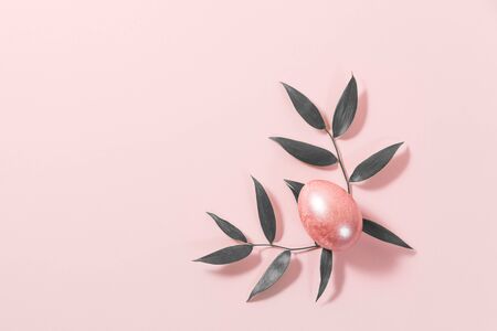 One pink Easter egg on a pink background.の写真素材