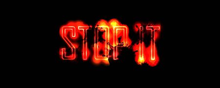 Neon red letters on a black background. Stop it. Design concept.の写真素材