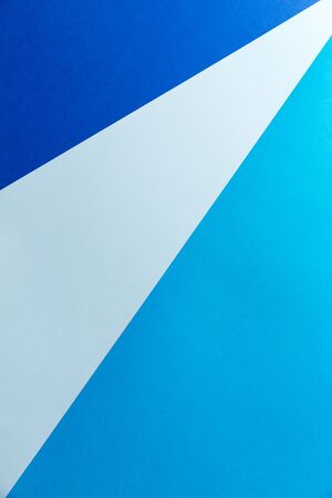 Paper background of three trending colors for writing text. Ready-made solution for the designer. Geometric lines made of cardboard sheets. Background for the text. Stylish abstract background. Graphic design.の写真素材