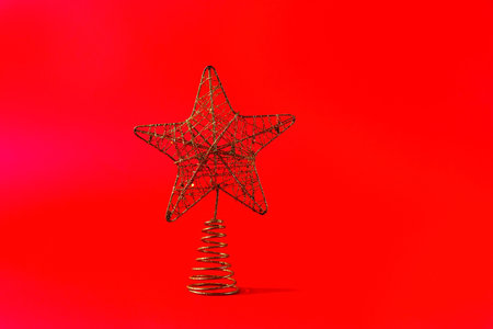 New years item in the form of a star on a red background.