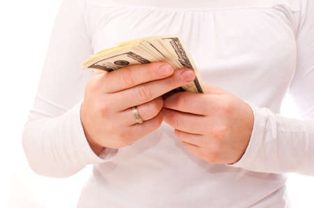 bundle of dollars in the handsの写真素材