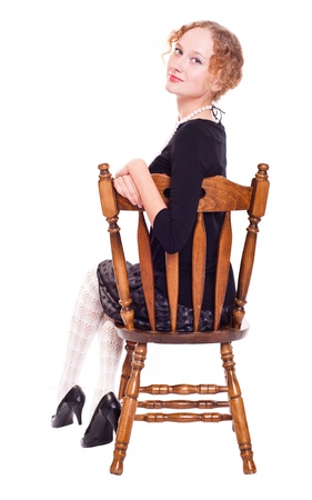 girl sitting on a chairの写真素材