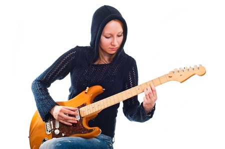 young woman with electric guitarの写真素材