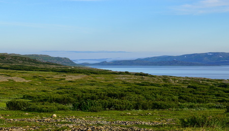 A northern bay with an island in tundra.の写真素材