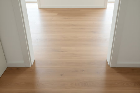 The bright, natural light highlights the beautiful wood grain and clean lines of this inviting spaceの写真素材