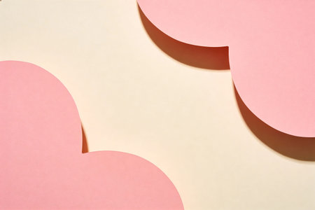 Minimalist composition featuring overlapping curved elements in soft pink and cream tones, creating...