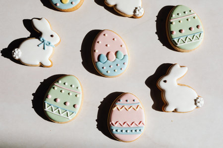 A delightful assortment of freshly baked Easter cookies featuring charming bunny and egg shapes...