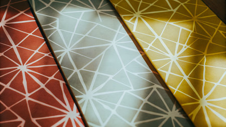 Vibrant geometric patterns in red, blue, and yellow create a striking visual effect, highlighting textures and designs ideal for creative projects and interior designの写真素材