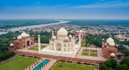 Iconic white marble mausoleum set in expansive gardens, surrounded by detailed architecture and lush greenery, representing historical and cultural heritageの写真素材