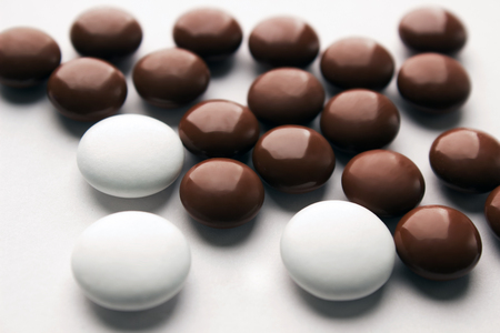 Multi-color pills on white backgroundの写真素材