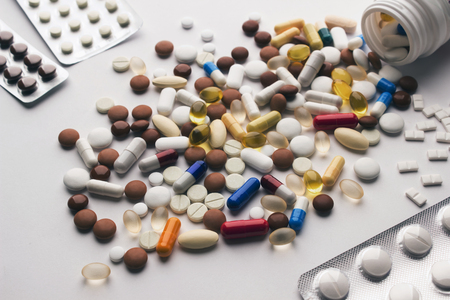 Multi-color pills on white backgroundの写真素材