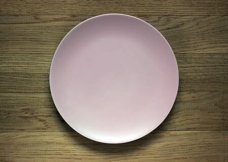 Empty plate on the wooden tableの写真素材