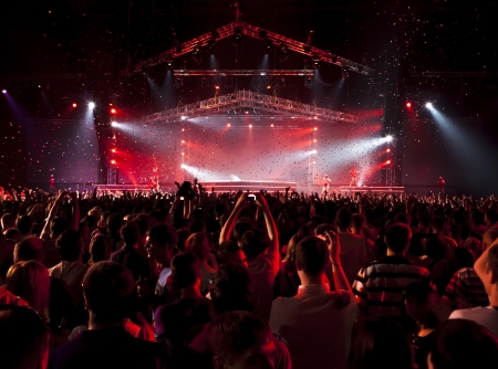 Silhouettes of people and musicians on concert and rays of lightのeditorial素材