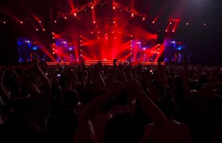 Silhouettes of people and musicians on concert and rays of lightのeditorial素材