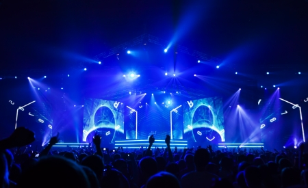Silhouettes of people and musicians on concert and rays of lightのeditorial素材
