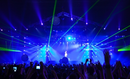 Silhouettes of people and musicians on concert and rays of lightのeditorial素材