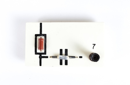 old device for connecting a resistor and a capacitor for physics lessons isolated on white backgroundの写真素材