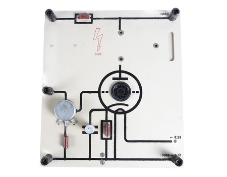 old device for connecting a resistor and a capacitor for physics lessons isolated on white backgroundの写真素材