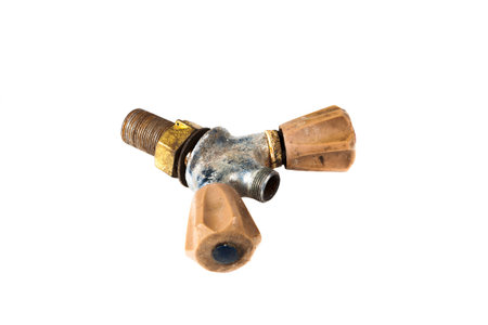 old faucet isolated on a white background