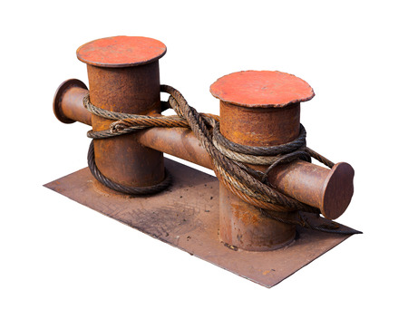 Close-up of a mooring rope with a knotted end tied around a cleatの写真素材