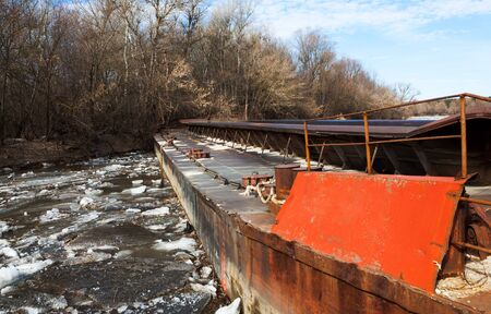 old rusty barge on a riverの写真素材
