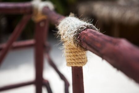 wooden structure with a thick rope closeupの写真素材