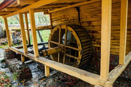 Water Mill in the autumn forestの写真素材