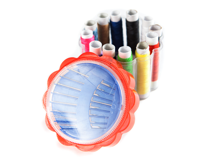 set of threads and needles on a white backgroundの写真素材