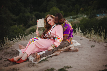 closeup portrait of a european woman and african american manの写真素材