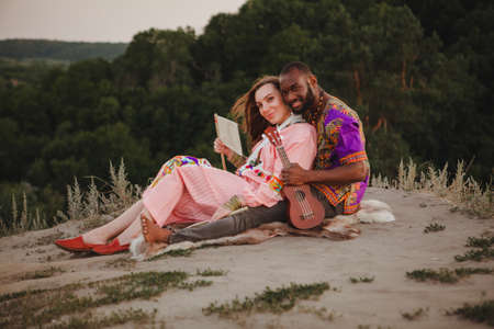 closeup portrait of a european woman and african american manの写真素材