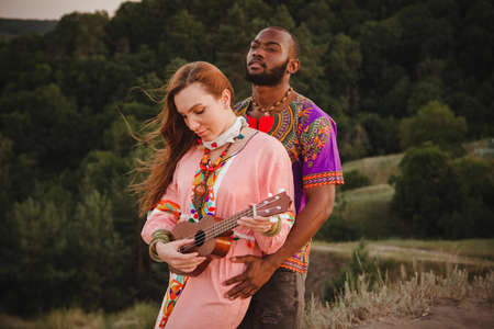 closeup portrait of a european woman and african american manの写真素材