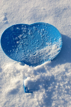 blue heart set on snowの写真素材