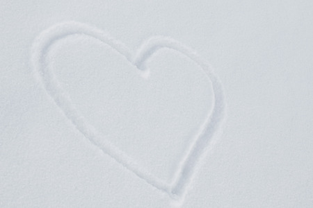 heart on the white snow, on a cold winter dayの写真素材