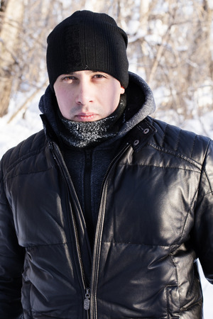 A handsome man in a leather jacket in black hatの写真素材