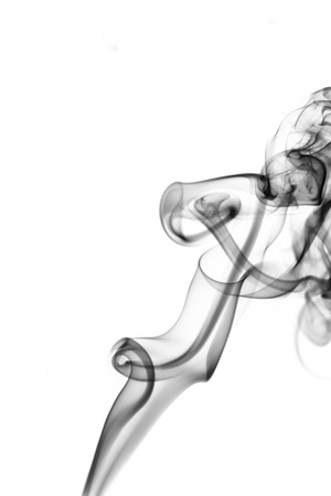 the image of smoke on a white background. Isolated black smokeの写真素材