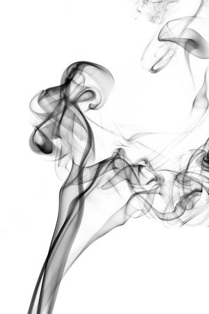 the image of smoke on a white background. Isolated black smokeの写真素材