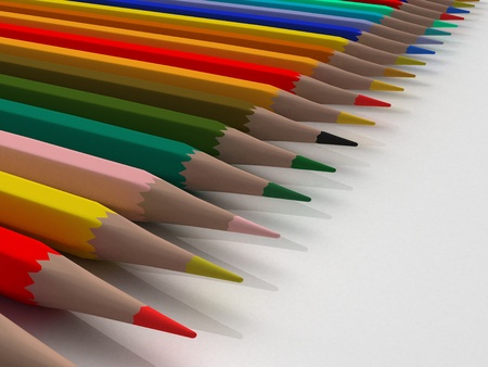 Colored pencils in a line on a white back ground の写真素材