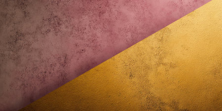 A textured wall displays a striking geometric pattern with a blend of pink and yellow colors. Subtle imperfections add depth and character to the artwork.の素材
