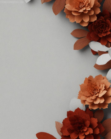 Colorful paper flowers in shades of red and orange are strategically placed on a soft gray background, showing a beautiful, artistic arrangement for decoration.の素材