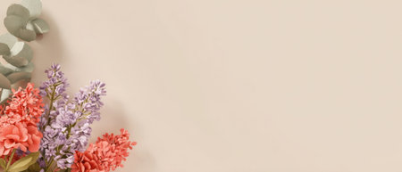 Brightly colored flowers in shades of pink and purple are arranged in a corner against a soft pastel background, adding a decorative touch to the space.の素材