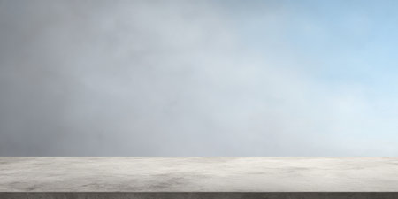 A smooth concrete surface is shown in the foreground with a soft, misty blue sky in the background. The scene feels calm and serene, ideal for various uses.の素材