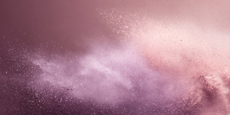 Colorful dust clouds rise in the air, blending soft pink and purple shades. This scene captures the beauty of nature as the sun sets, illuminating the atmosphere.の素材